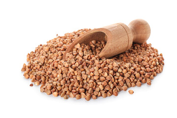 Wooden scoop on heap of buckwheat grains against white background