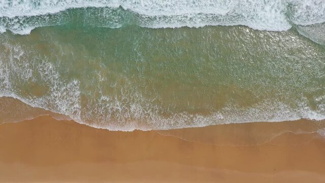 sea ocean waves reaching shore.Beach with aerial drone. Beach clear turquoise top view. Beautiful beach ,aerial drone footage