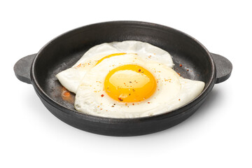 Frying pan with tasty eggs isolated on white background