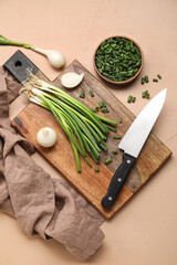 Composition with green onion on color background