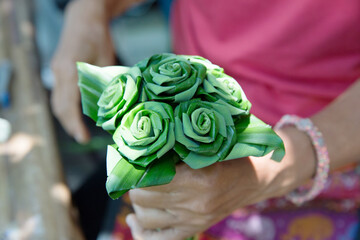 Hand hold a make a Pandan leaf roses