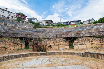 Ancient amphitheater or antique theatre of Ohrid with view of old town by Lake Ohrid in Macedonia