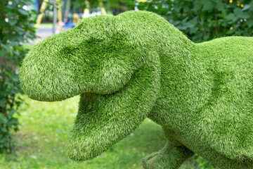 Decorative floral composition statue of dinosaur as artificial plant animal topiary for garden and...