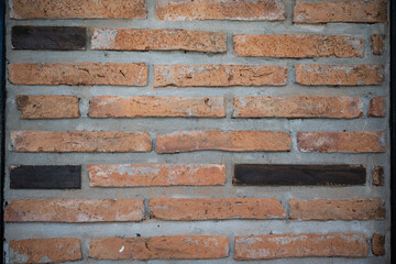 Brick wall background on construction site.Different wood square and red bricks background.Brick wall, abstract background texture and copy space.