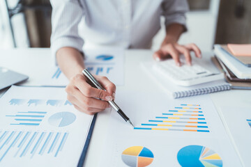 Businessman analysis marketing plan, Accountant calculate financial report, computer with graph chart. Business, Finance and Accounting concepts.