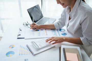 Businessman analysis marketing plan, Accountant calculate financial report, computer with graph chart. Business, Finance and Accounting concepts.