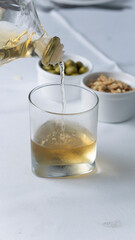 drink with nuts and side dishes