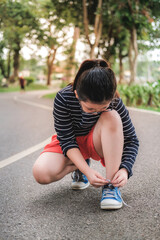 Cute Asian Thai Girl tie Shoelaces.