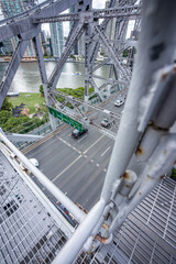 Close-up view of steel truss bridge structure and pedestrian walkway