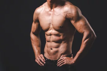 Fotobehang Sportschool strong athlete caucasian man person exercising in the sport gym, workout exercise training in modern fitness studio for body muscle to fit and slim, heavy bodybuilding and healthy lifestyle people  © chokniti