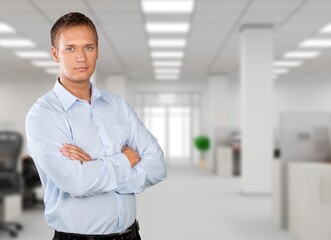 Young millennial confident man. Handsome guy pose alone at workplace or apartment. Professional occupation, freelance portrait, homeowner person concept