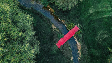 Red Bridge Over Small Stream