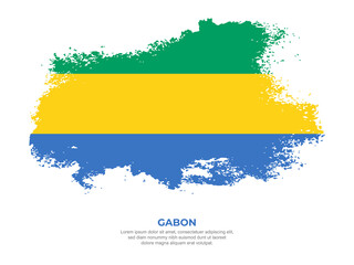 Vintage grunge style Gabon flag with brush stroke effect vector illustration on solid background