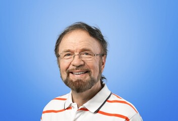 Happy man posing on the color background