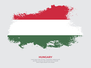 Naklejka premium Vintage grunge style Hungary flag with brush stroke effect vector illustration on solid background