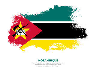 Vintage grunge style Mozambique flag with brush stroke effect vector illustration on solid background