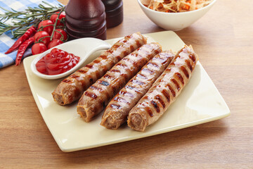 Grilled sausages with cabbage and sauce