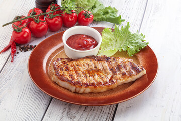 Grilled pork steak with ketchup