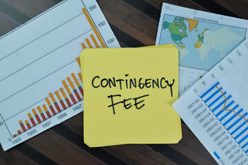 Concept of Contingency Fee write on sticky notes isolated on Wooden Table.