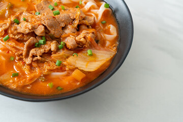 Korean udon ramen noodles with pork in kimchi soup