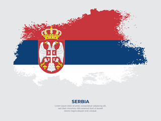 Fototapeta premium Vintage grunge style Serbia flag with brush stroke effect vector illustration on solid background