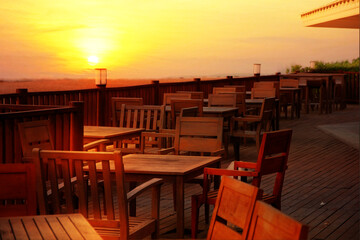 wood terrace with wooden table and desk  at sea view point with sun set nature background