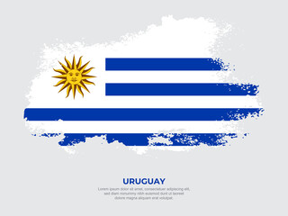 Vintage grunge style Uruguay flag with brush stroke effect vector illustration on solid background