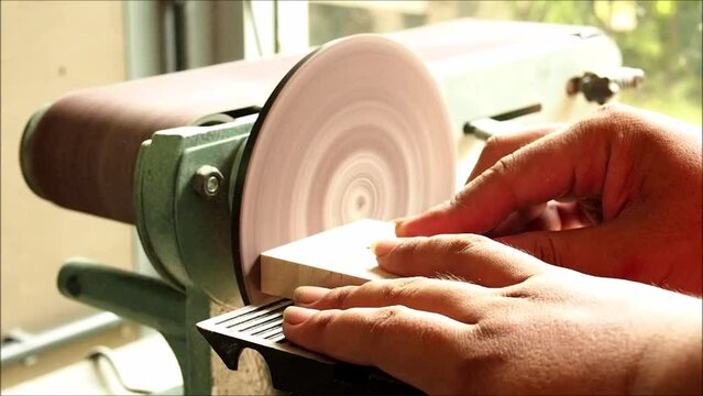 Sand the wood with a belt sander