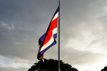 Beautiful view the Costa Rica Flag waving dramatically in the sky - obrazy, fototapety, plakaty