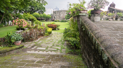 Old-world Intramuros is home to Spanish-era landmarks like Fort Santiago, with a large stone gate and a shrine to national hero José Rizal.