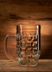 Empty beer pint on wood