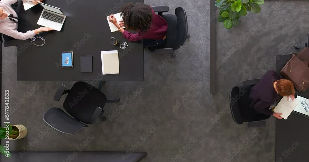 Aufkleber Timelapse of a productive team of employees working together in the office from above. Multitasking colleagues collaborating, networking and developing new ideas for a successful startup company