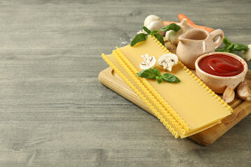 Concept of tasty cooking, cooking lasagna, space for text