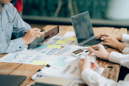 The atmosphere in the meeting room where the businessmen are meeting, information papers and charts are placed on the table to support the business planning meeting to grow. Business idea