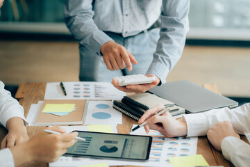 The atmosphere in the meeting room where the businessmen are meeting, information papers and charts are placed on the table to support the business planning meeting to grow. Business idea