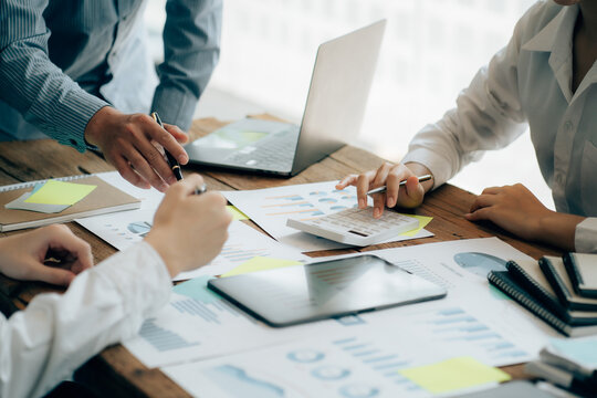 The atmosphere in the meeting room where the businessmen are meeting, information papers and charts are placed on the table to support the business planning meeting to grow. Business idea