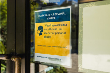 View of sign Wearing Masks in a courthouse is a matter of personal choice in downtown Vancouver