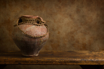 Antique jug on wooden shelf - 517848678