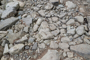 Mountain road in the Carpathians with large stones. Stone route to the mountains. Close-up of stones. Difficult path to the top of the mountain.