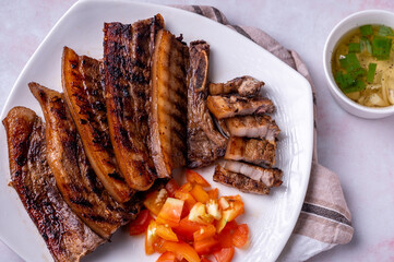 Inihaw na Liempo-Grilled Pork Belly with tomato and vinegar dip on the side