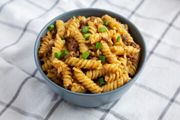 Homemade One-Pot Cheeseburger Pasta in Bowls, side view. Close-up.