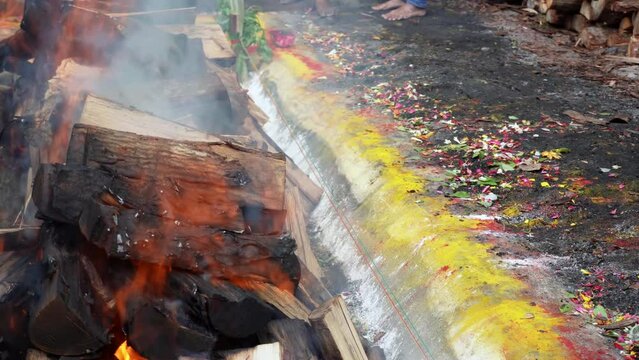 The parai drum music instrument is tuned with heat from burning fire of wood