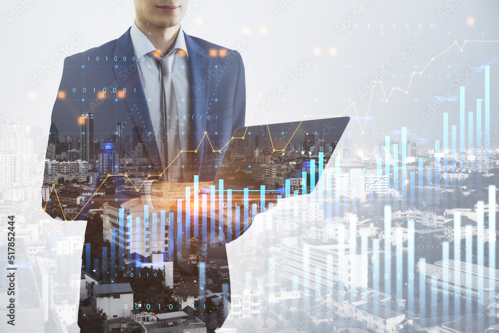 Poster man using tablet with glowing and growing business graph hologram on blurry city background. plannin