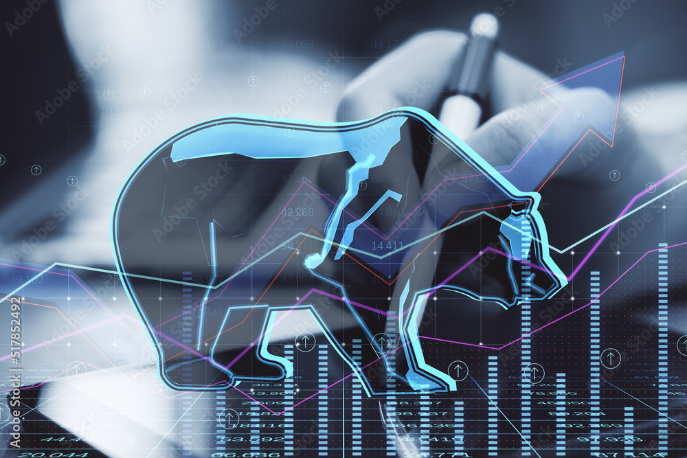Poster hands at desktop using digital tablet with pen and abstract hologram of bear on financial stock market graph representing stock market crash or down trend investment on blurry background