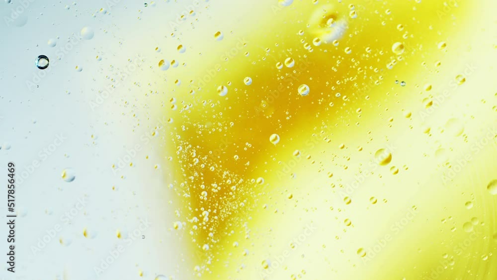 Aufkleber real close up oil bubbles in water rotation with color gradient abstract mixing background.