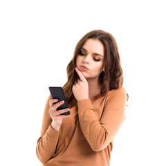 Fototapeta premium The girl reads messages on the phone. Online communication.