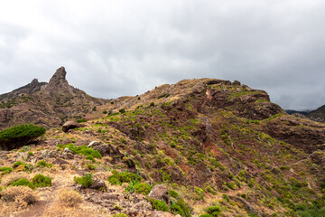 Panoramic view on El Dedo del Roque Pai crag, Roque Paez in the Anaga mountain range, Tenerife, Canary Islands, Spain, Europe. Scenic hiking trail from Afur to Taganana through canyon Barranco de Afur