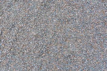 Texture of gravel stone used for farm driveway surface as background