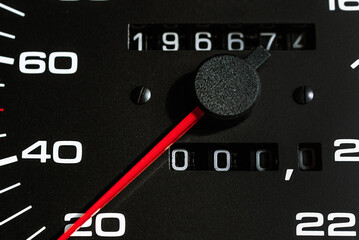 Black Car speedometer,dashboard.Red Arrow of odometer,tachometer.Close up.Selective focus.