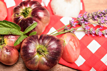 Still life with tiger tomato on wood table.